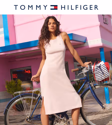 Model wearing a pale pink Tommy Hilfiger Dress