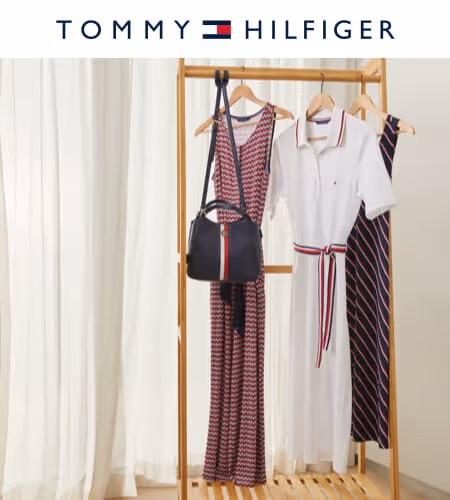 Photo of a rack holding different Tommy Hilfiger summer dresses