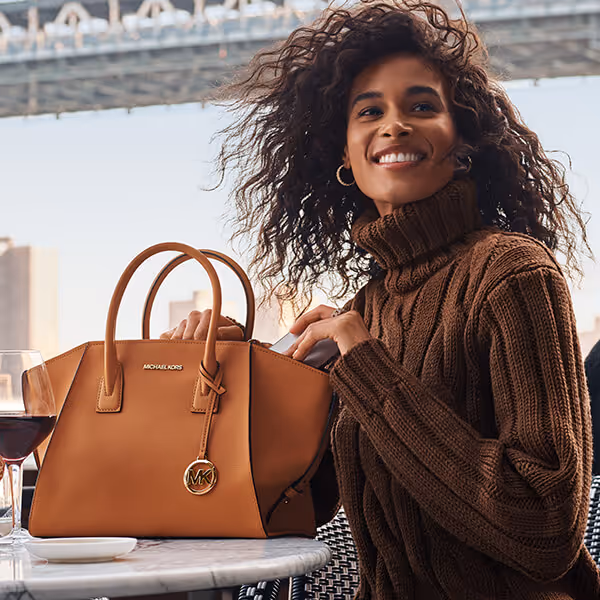 Young woman with a Michael Kors Avril bag