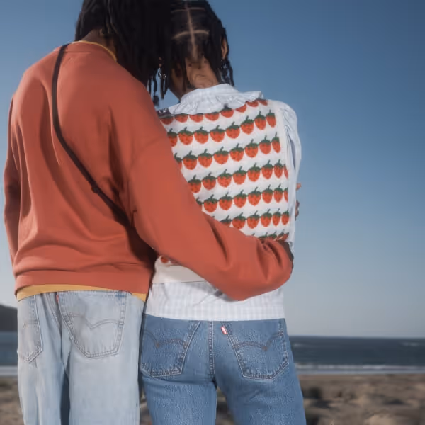 Young couple wearing Levi's jeans and sweaters