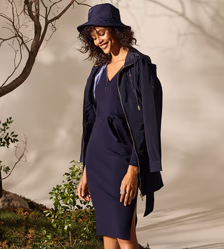 Young woman wearing Tommy Hilfiger Navy dress, jacket, and hat
