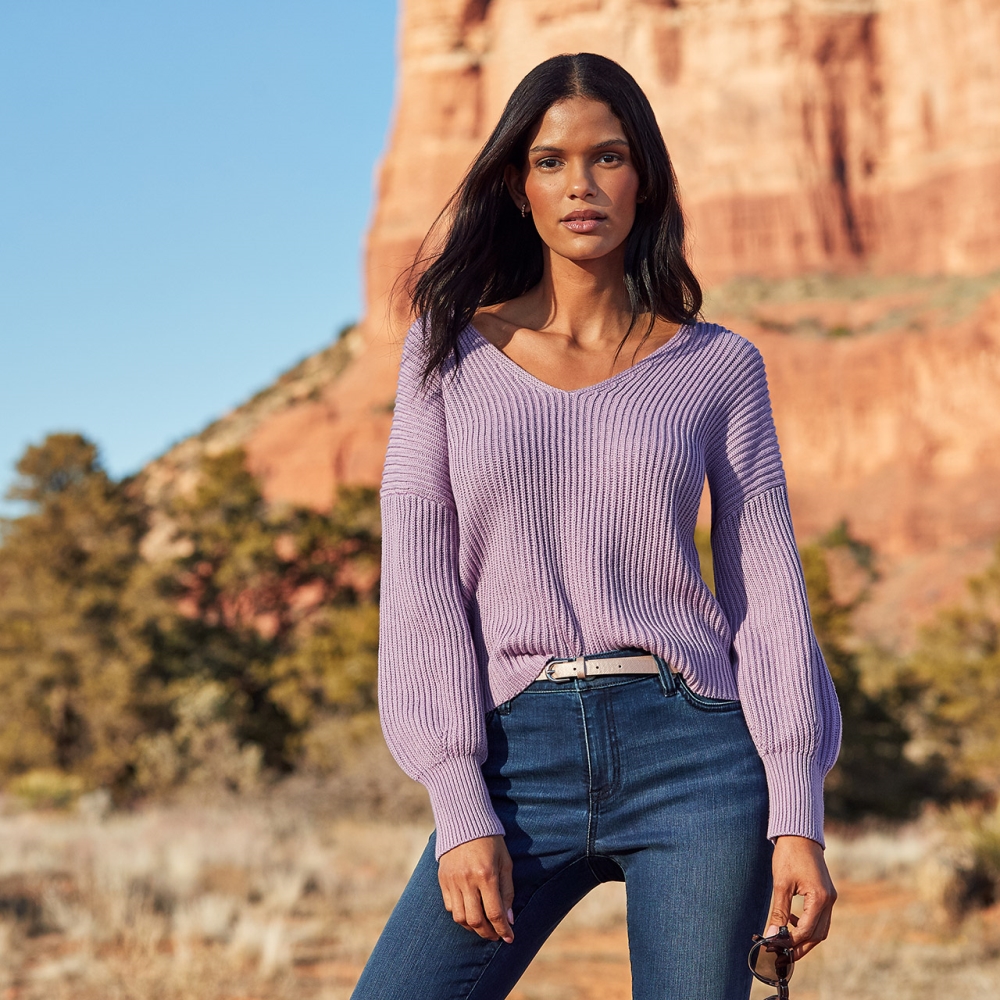 model in desert wearing lilac tommy bahama shirt and jeans 