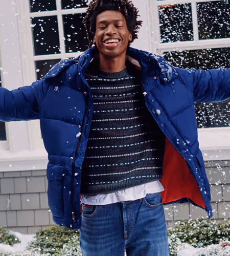 Young man wearing Tommy Hilfiger puffy coat