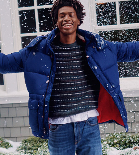 Young man wearing Tommy Hilfiger puffy coat