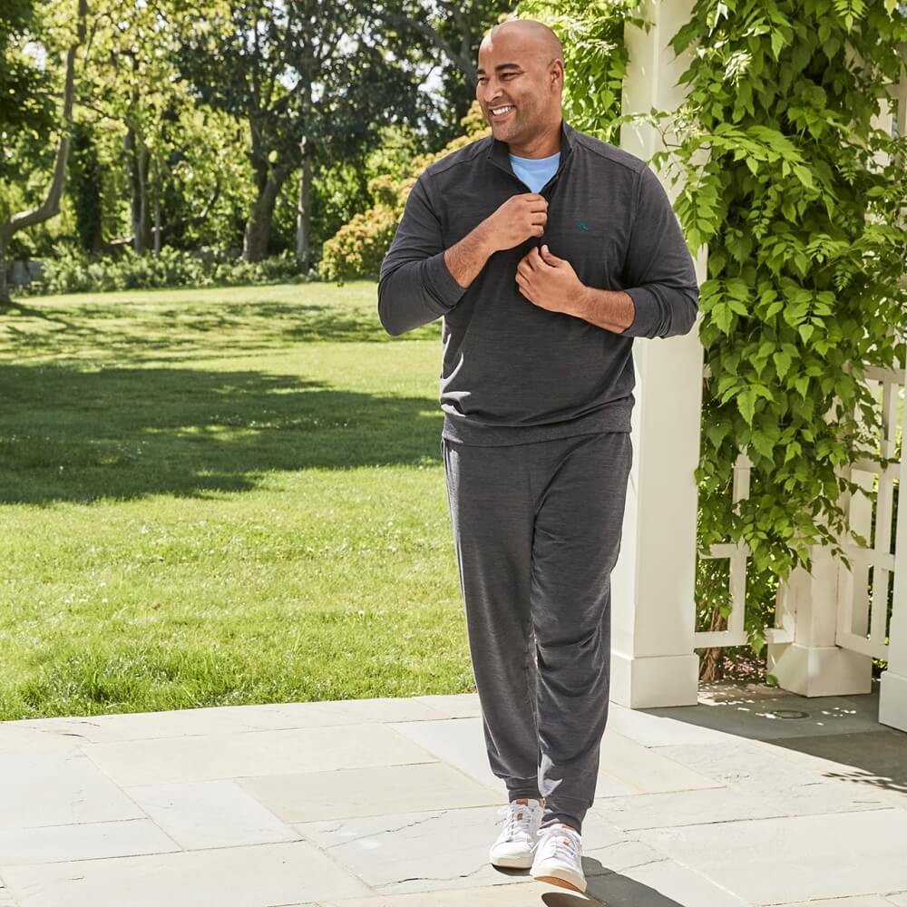 Man walking on a patio in Tommy Bahama Athleisure