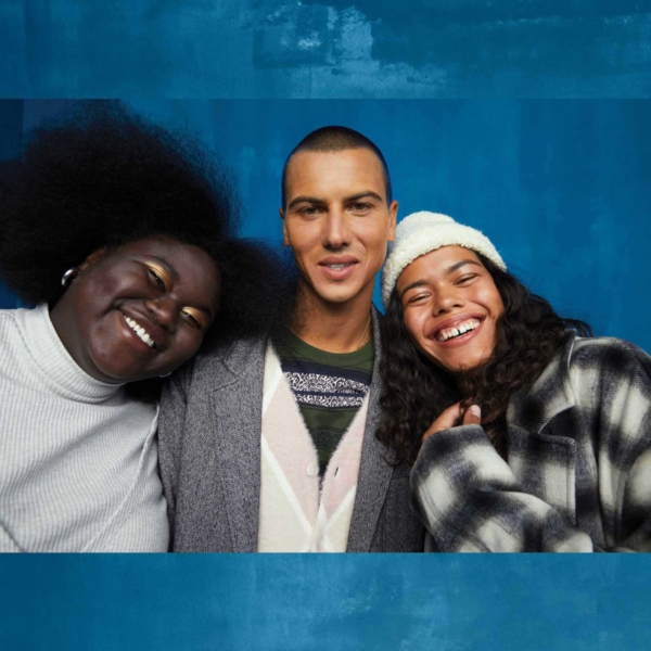 three models wearing levi's smiling