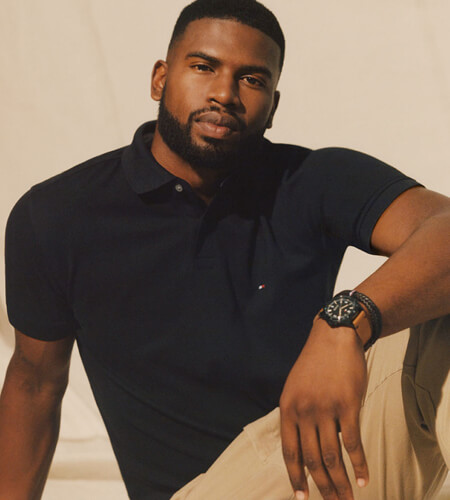 Model wearing Black Tommy Hilfiger short-sleeved collared shirt