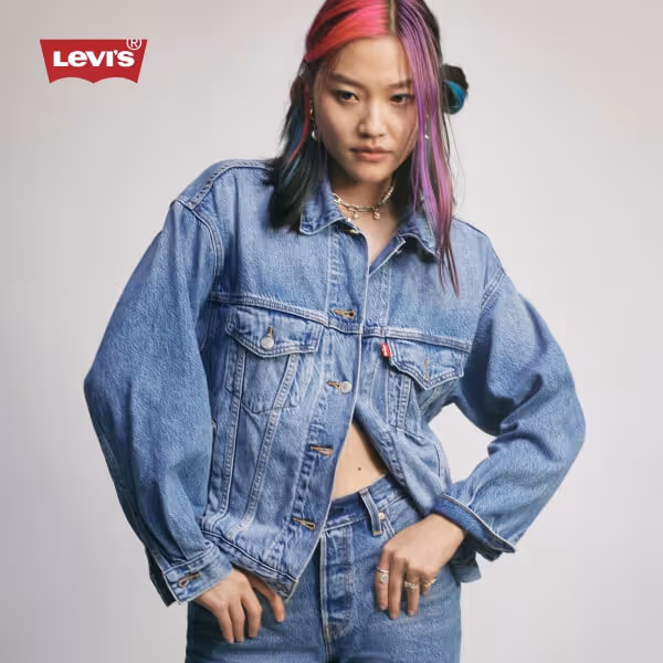 Model wearing Levi's denim jacket and jeans