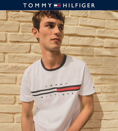 Young man wearing a classic style Tommy Hilfiger t-shirt