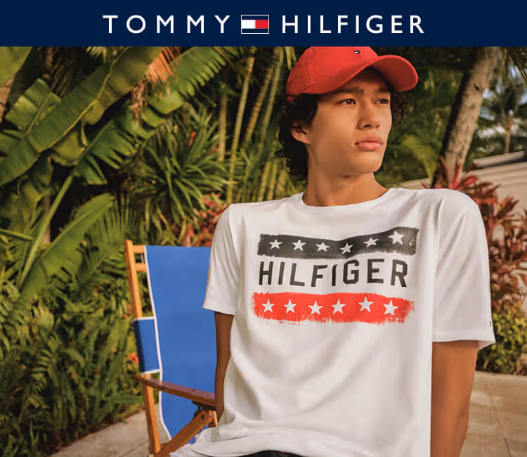 Model wearing Tommy hilfiger T-shirt on a patio