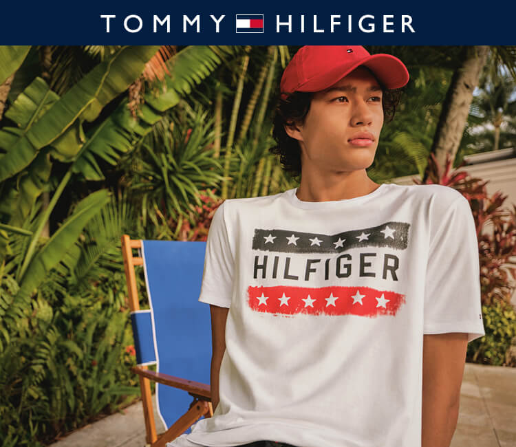 Model wearing Tommy hilfiger T-shirt on a patio