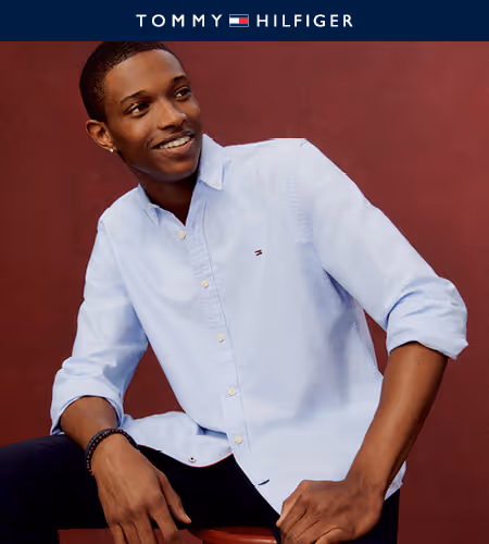 Model wearing white Tommy button-up shirt
