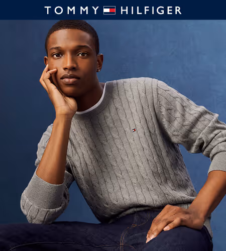 Model wearing gray Tommy Hilfiger sweater