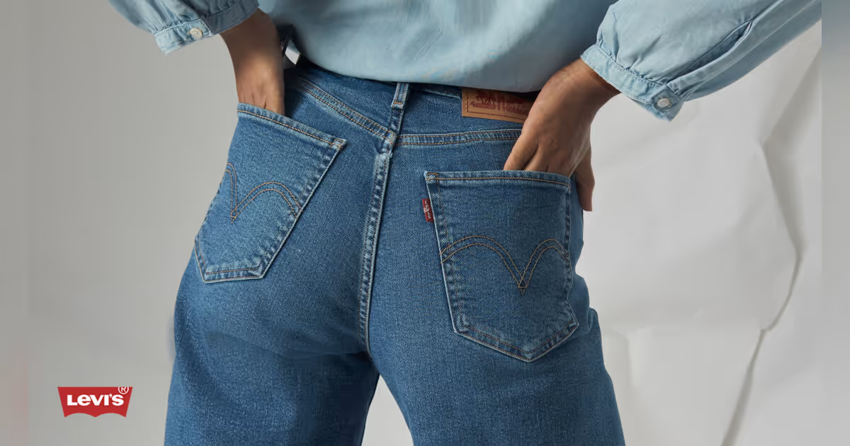 Model wearing Levi's jeans with hands in back pockets