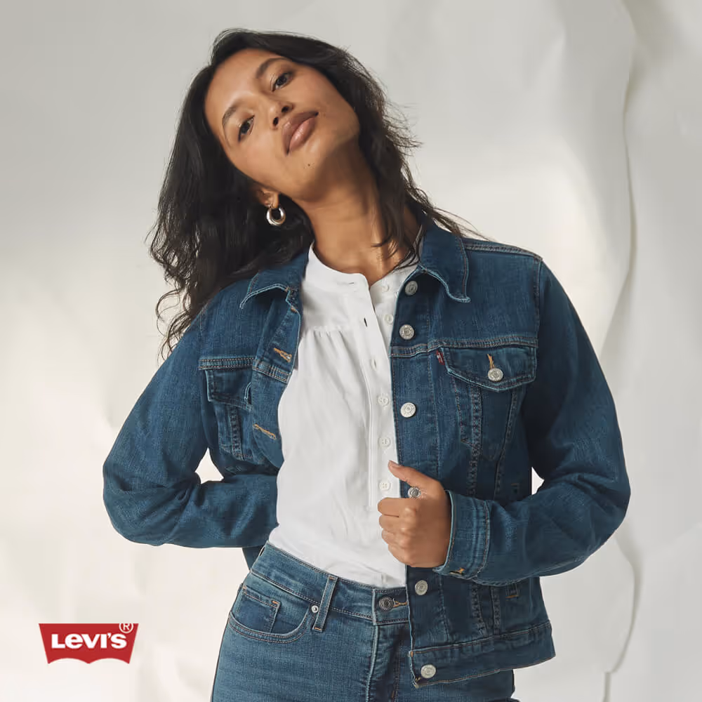 Model wearing Levi's denim jacket and jeans