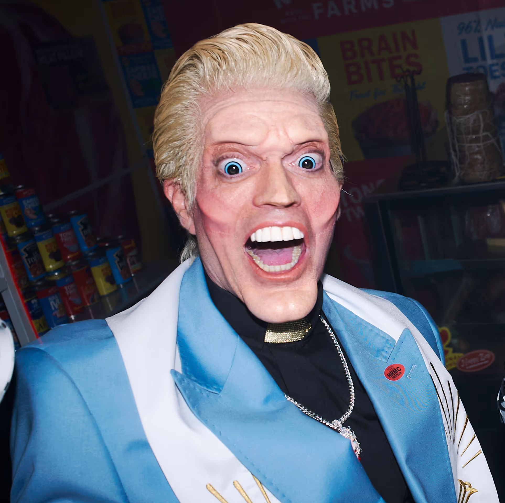 a man dressed in blue with large teeth and eyes