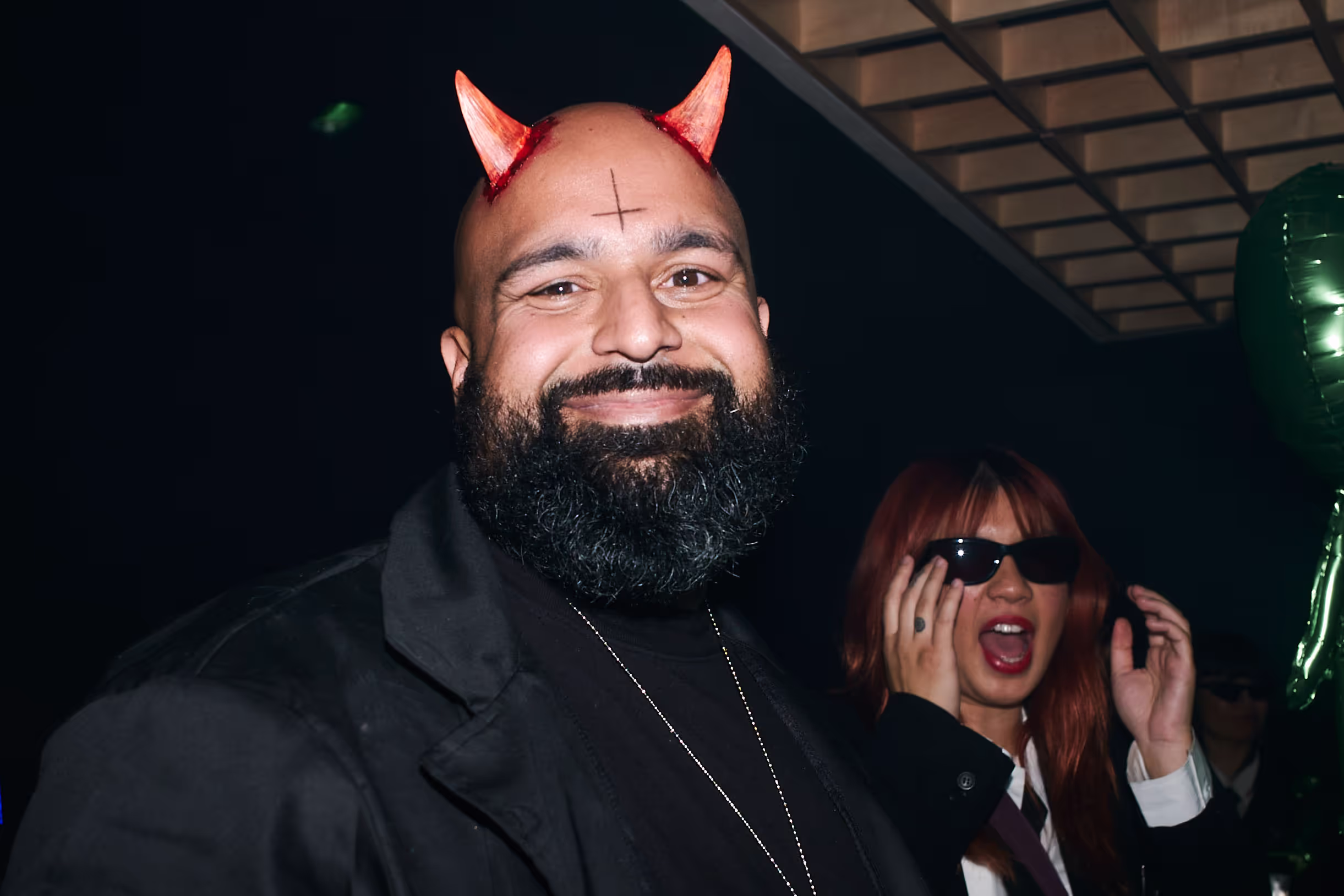 man with beard wearing horns