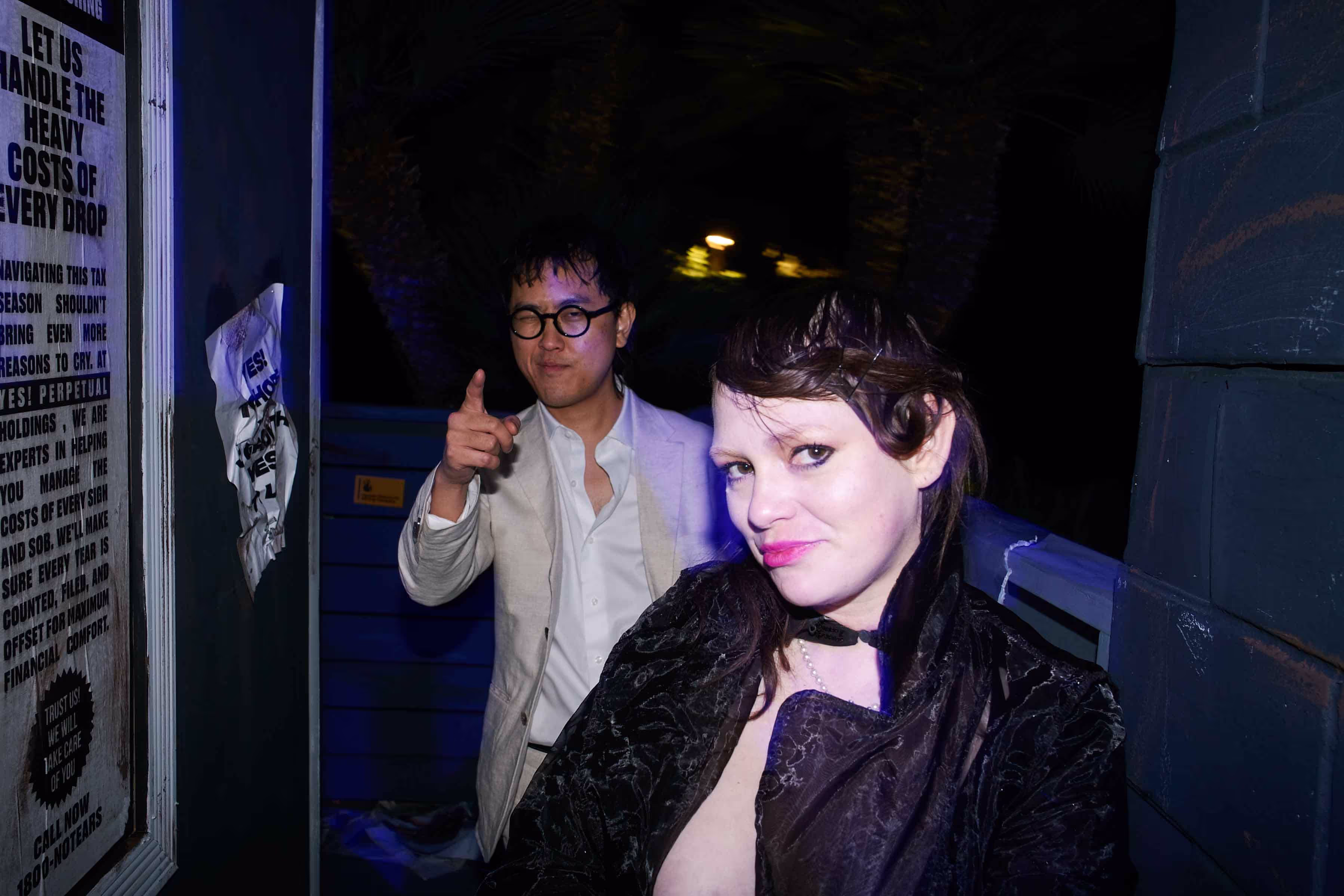 a couple standing in a dark hallway
