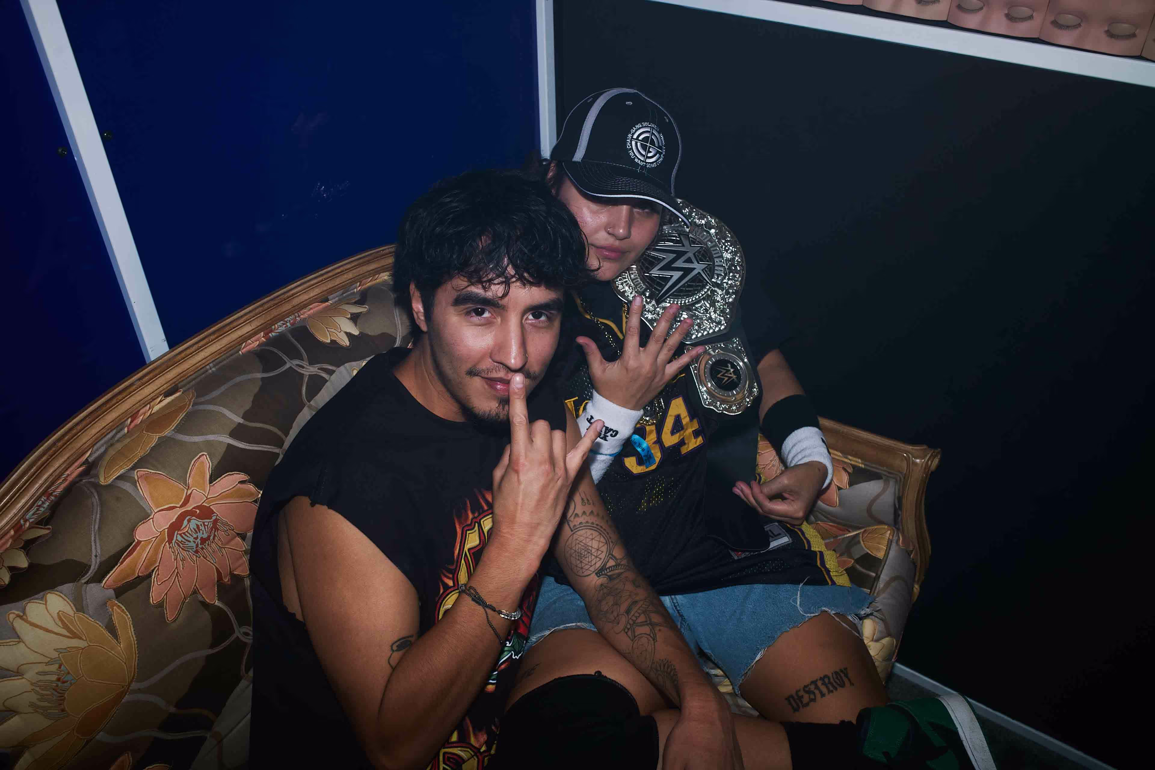 A man and a woman sitting on a couch.