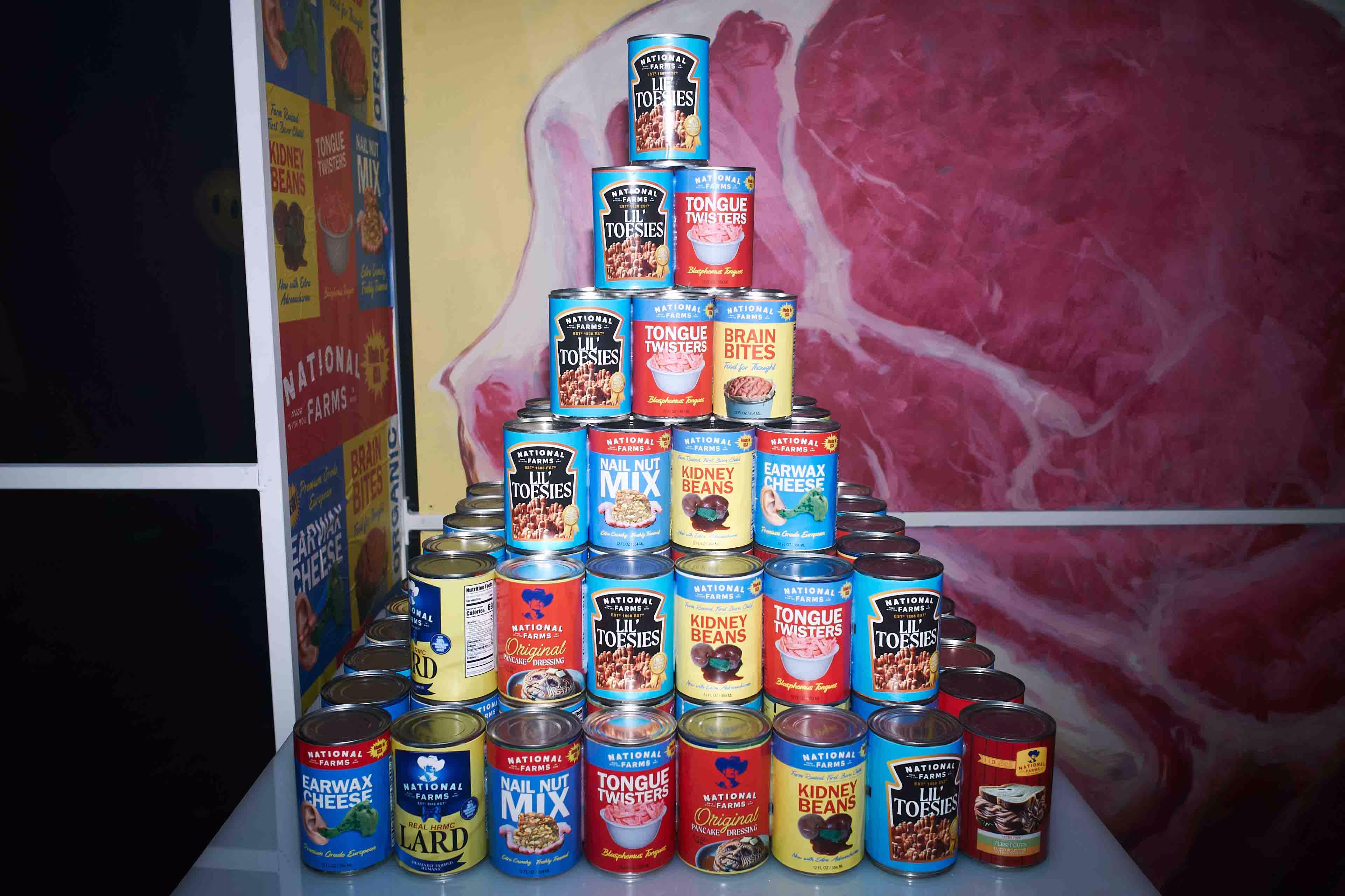 A stack of canned food items sitting on top of a table.