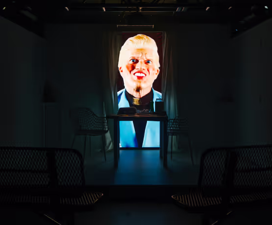 A television screen with a picture of a man's face on it.