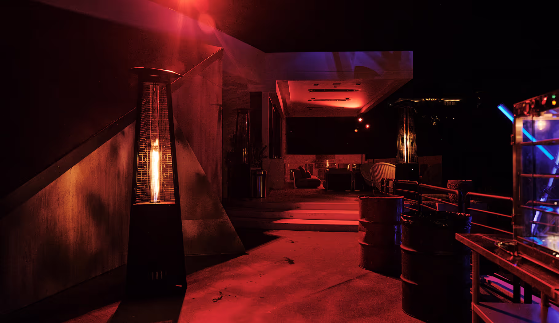 A dark hallway with a red light on the floor.