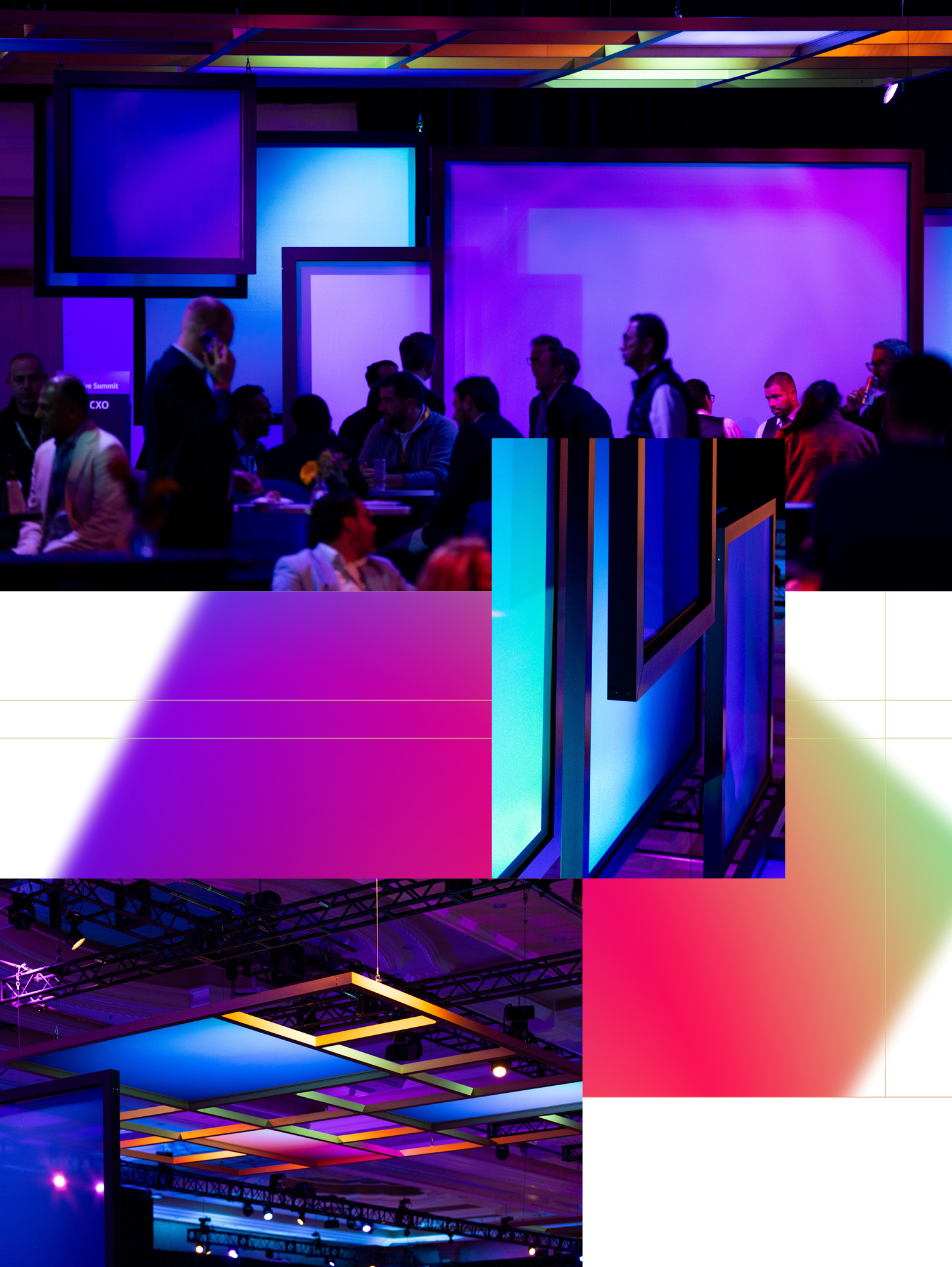 People seated and standing in a dimly lit conference room with blue and purple illuminated screens in the background.