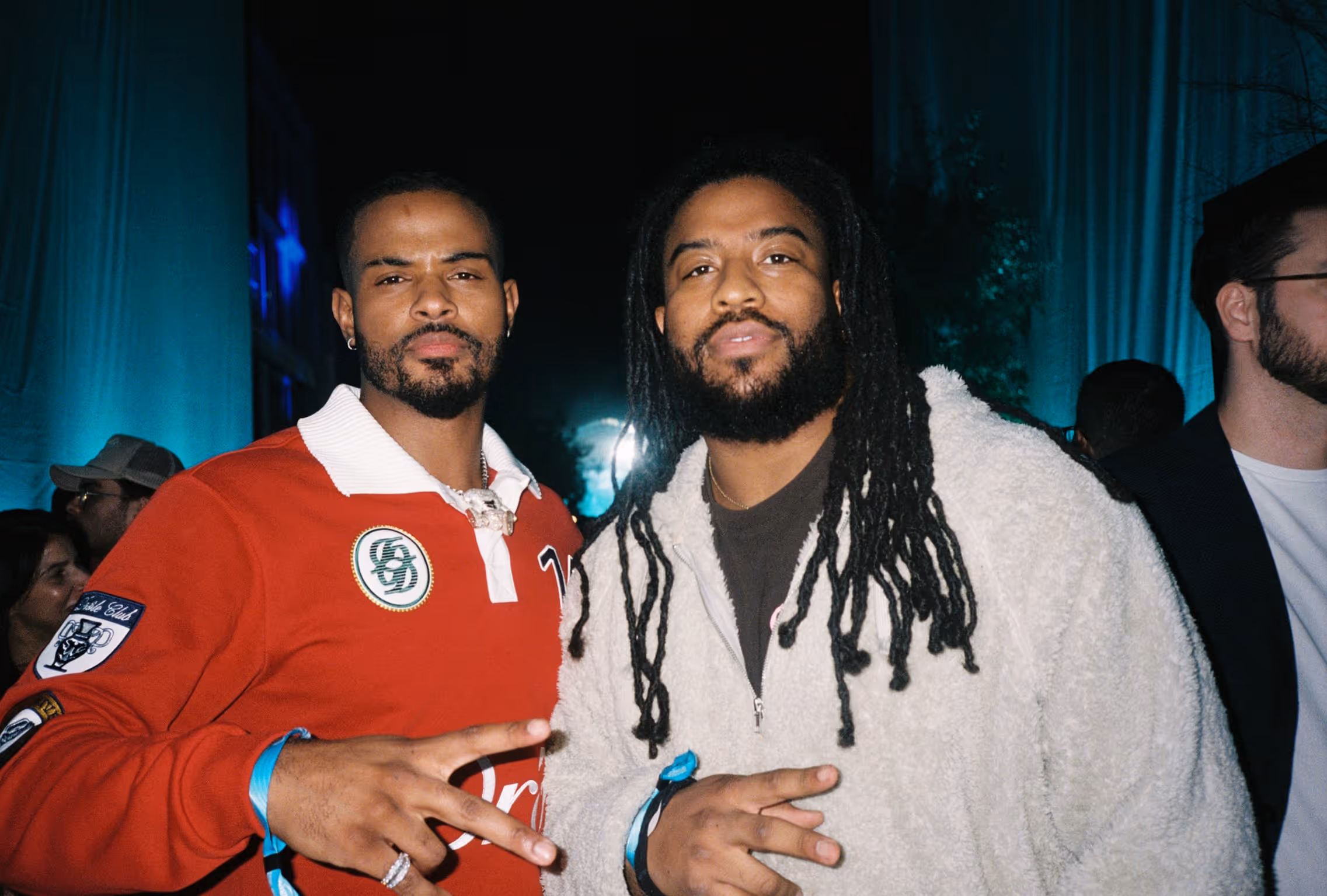 A couple of men standing next to each other.