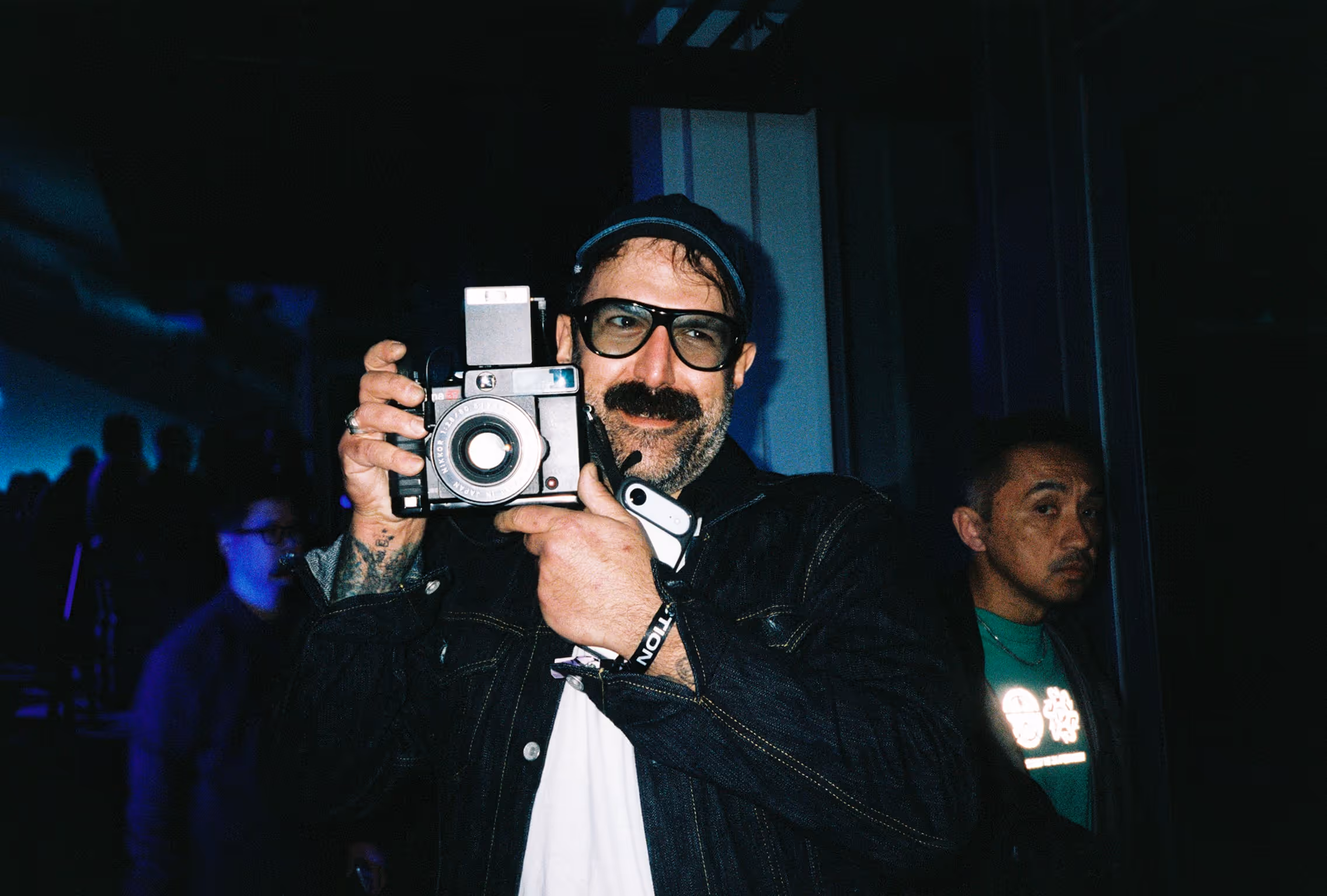 A man taking a picture with a camera.