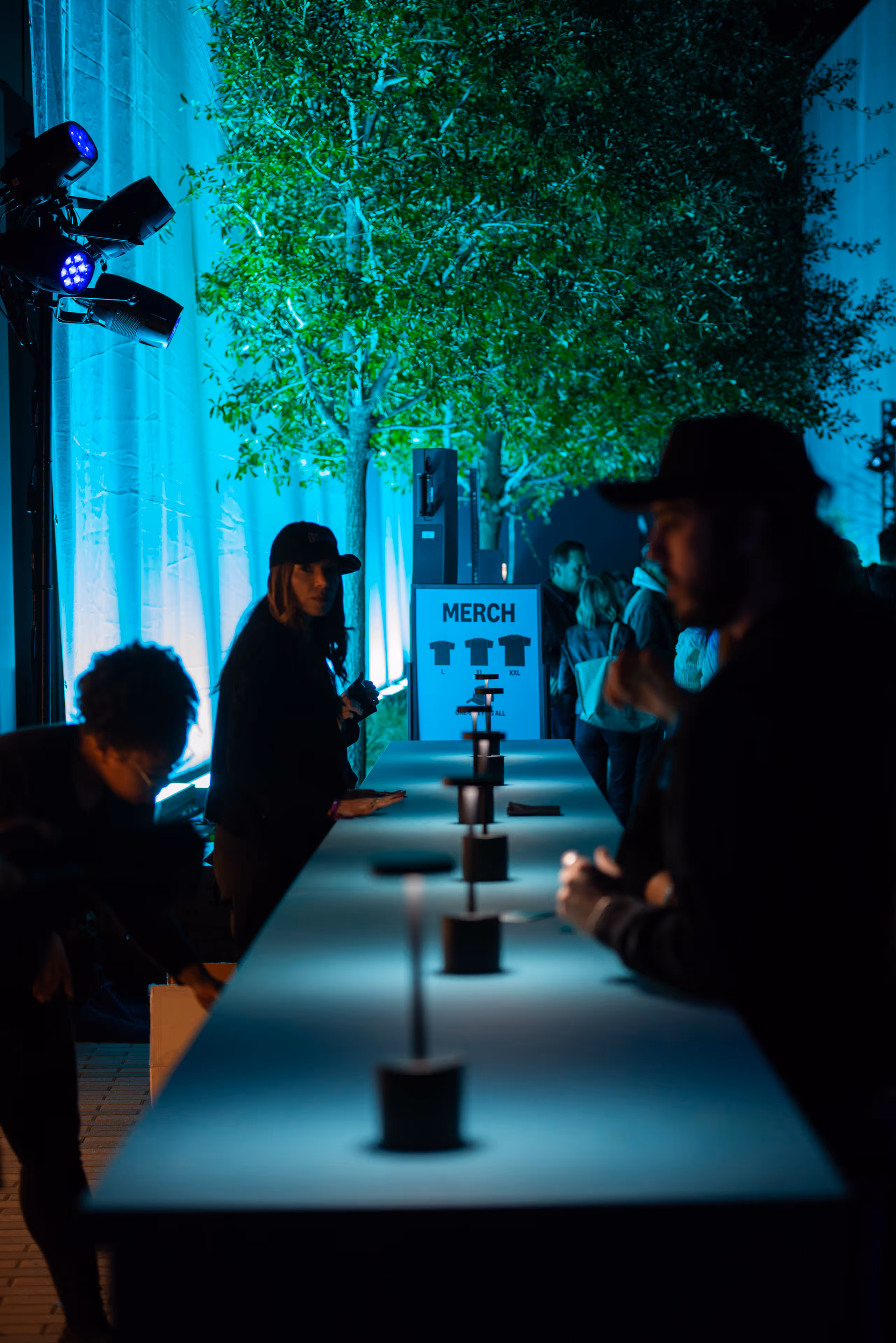 A group of people sitting at a long table.
