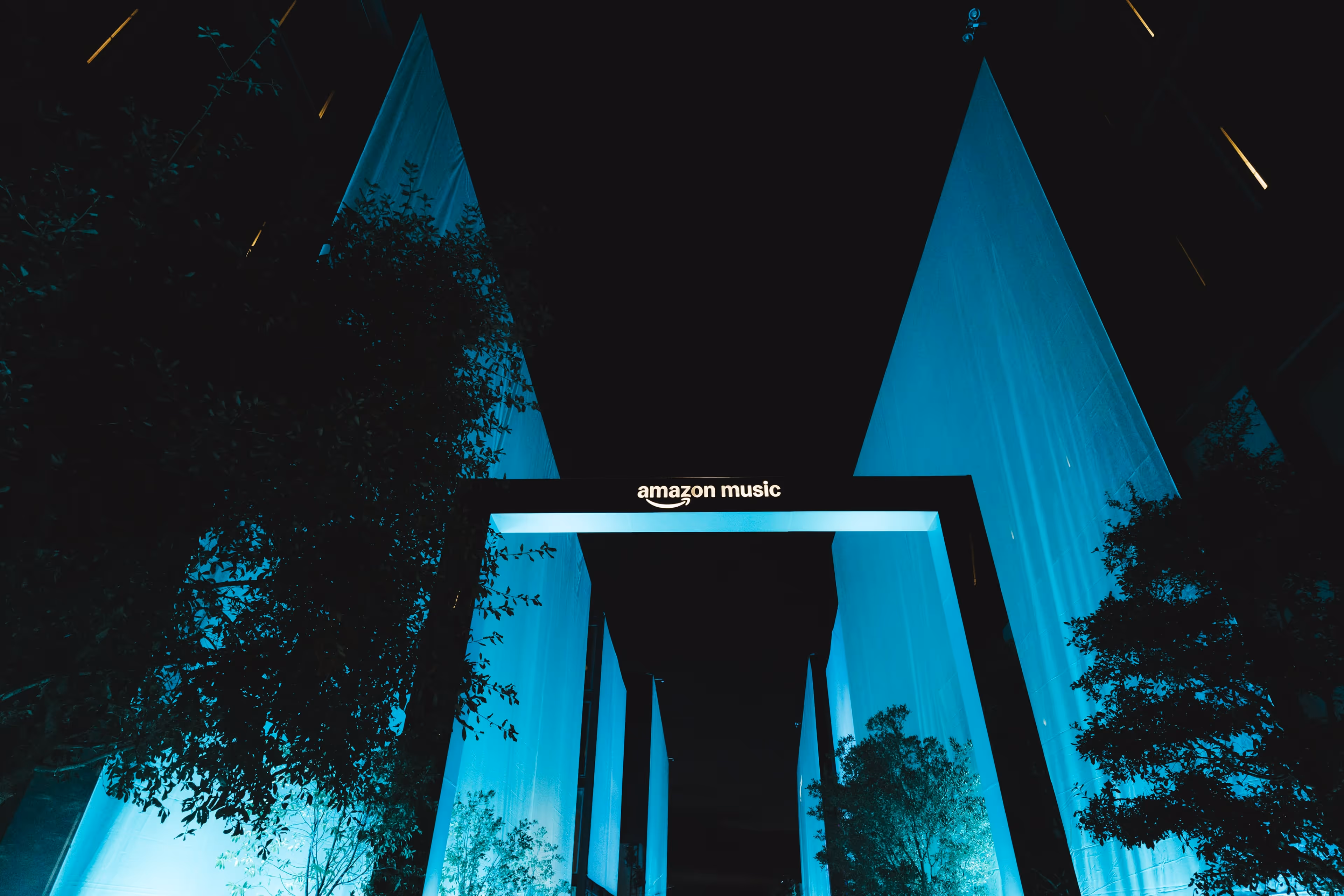 A couple of tall buildings sitting next to each other.