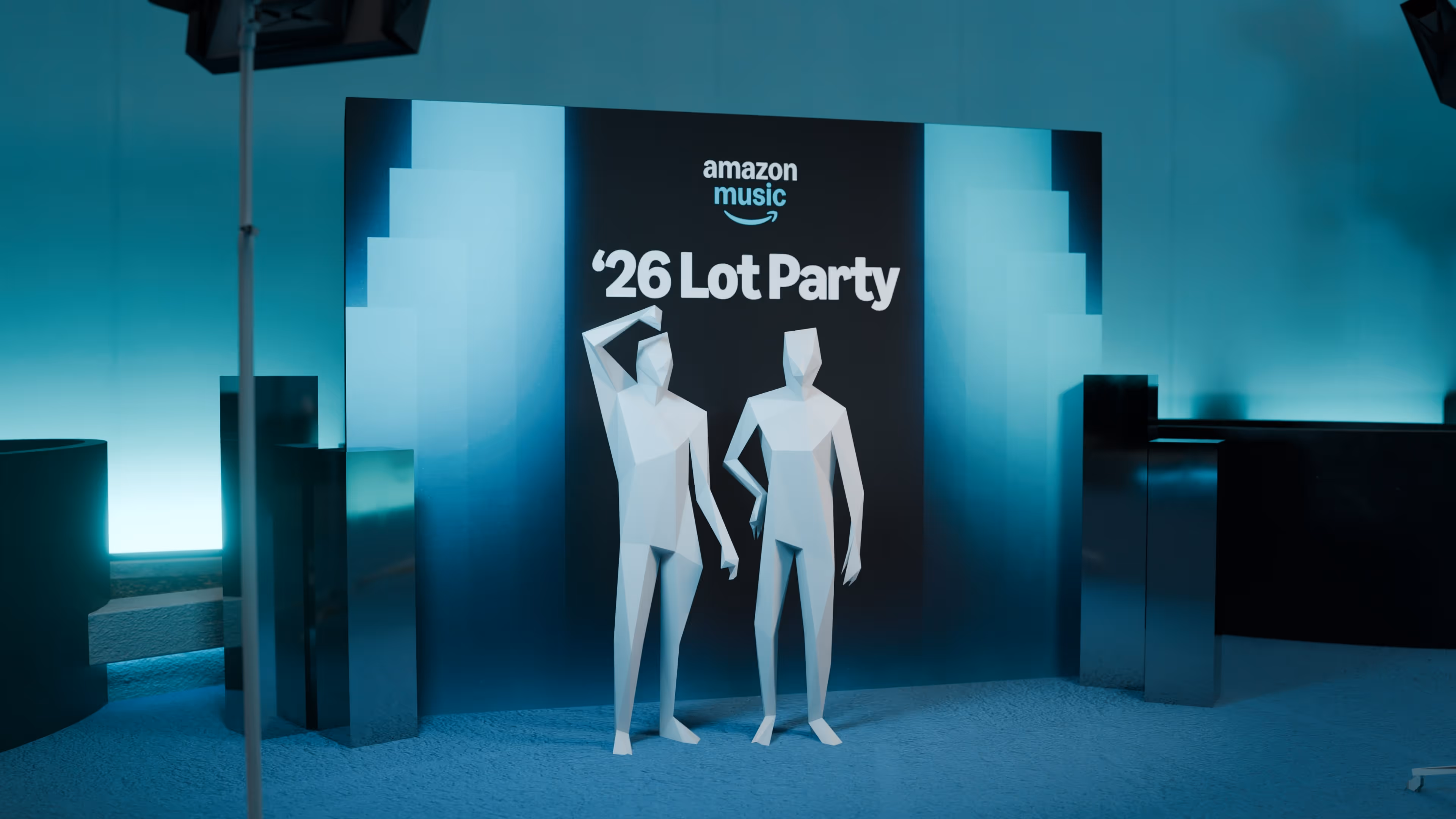 A couple of mannequins are standing in front of a sign.