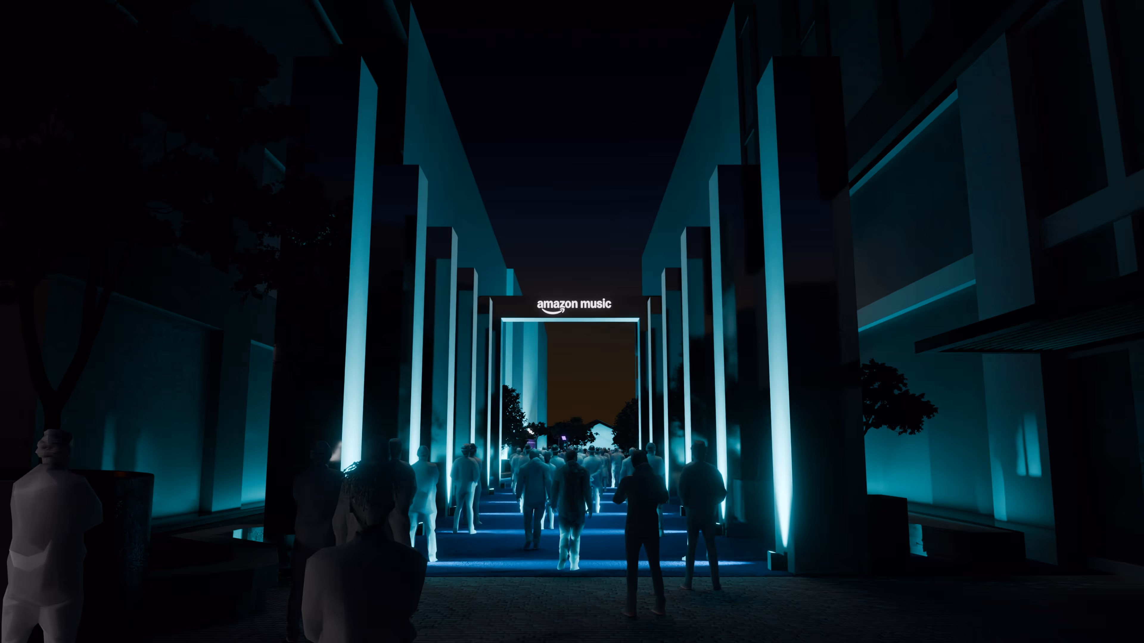 A group of people walking down a hallway at night.