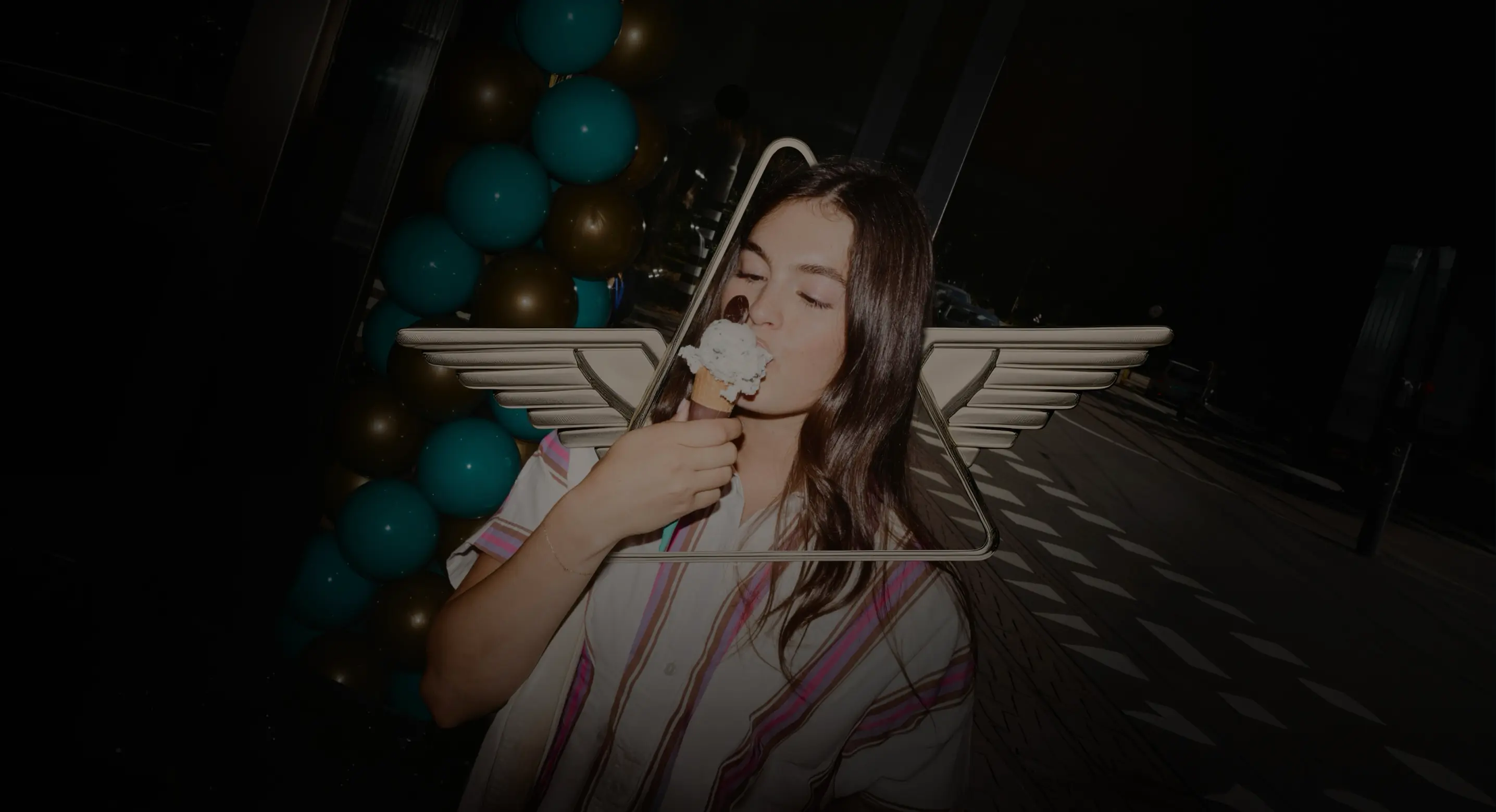 Hero image: Woman eating an ice cream cone in the middle of a Delta badge. 