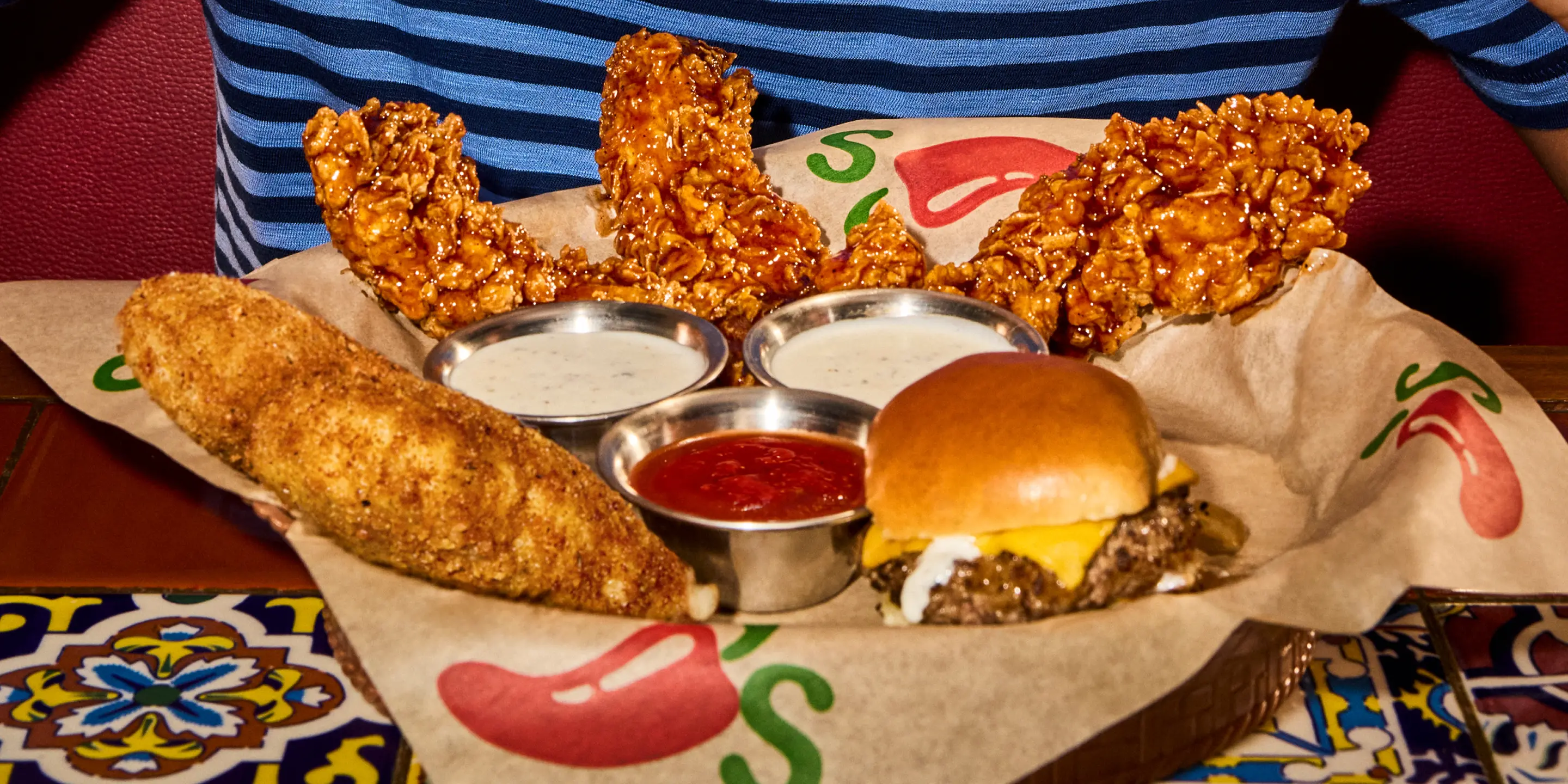 A building with a digital ad showcasing people on roller skates and the tagline "Milk hydrates better than water."