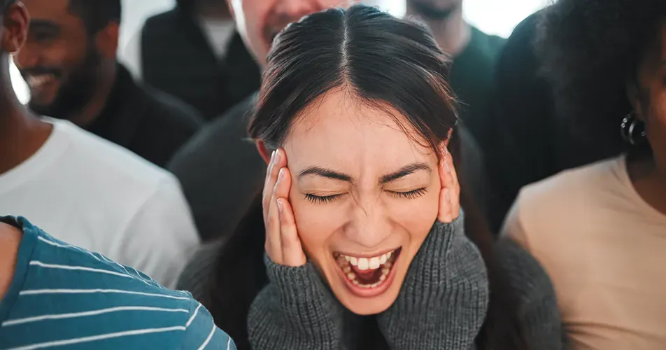 Person pausing to collect themselves during a wave of intense emotion, representing the experience of emotional dysregulation