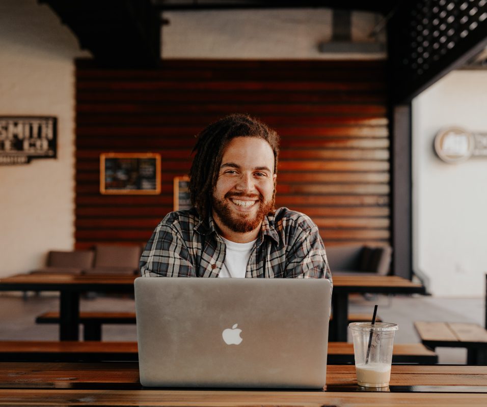 a man on the computer smiling