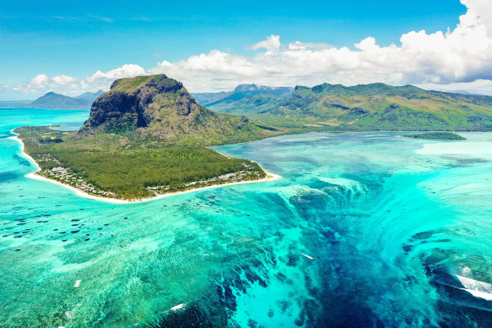 Aerial view of Le Morne Brabant in Mauritius with turquoise waters and an underwater waterfall illusion