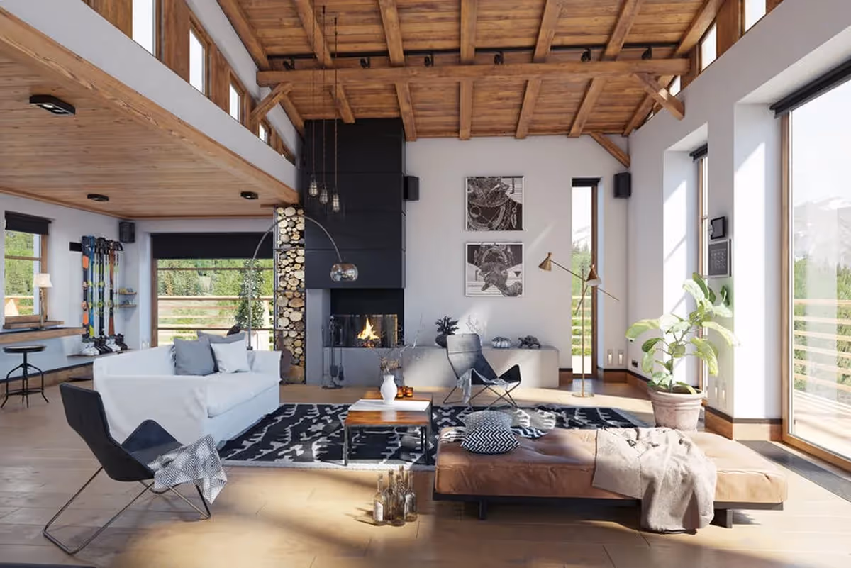 Vue ensoleillée d’un chalet en bois traditionnel à La Toussuire, entouré de paysages alpins estivaux.