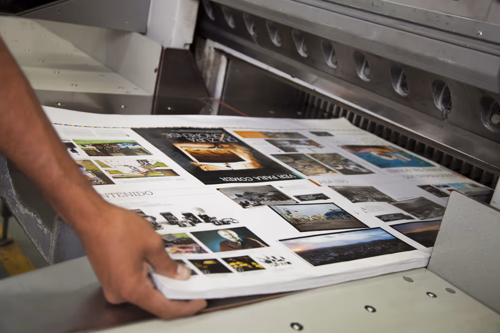 Photos being printed to large machine