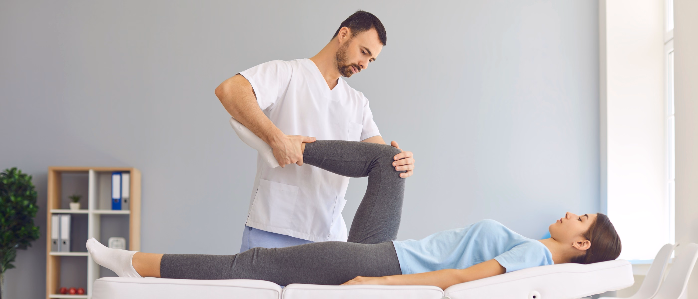 Physiotherapist guiding a patient through manual knee therapy as part of conservative management for a meniscus tear to reduce pain and improve mobility.