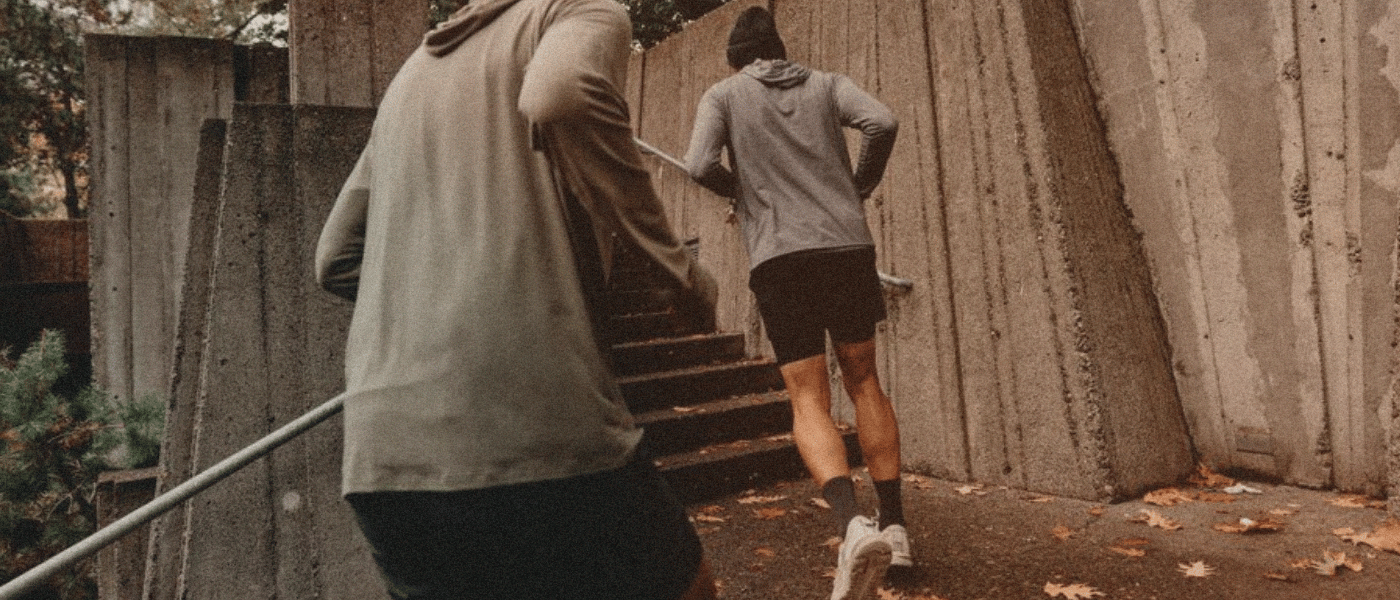 Runners running up a staricase