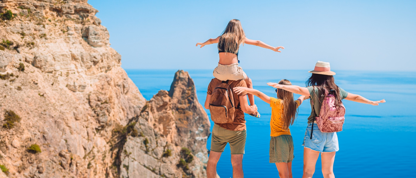 Active mother with family outdoors representing postpartum rehabilitation and return to daily activities