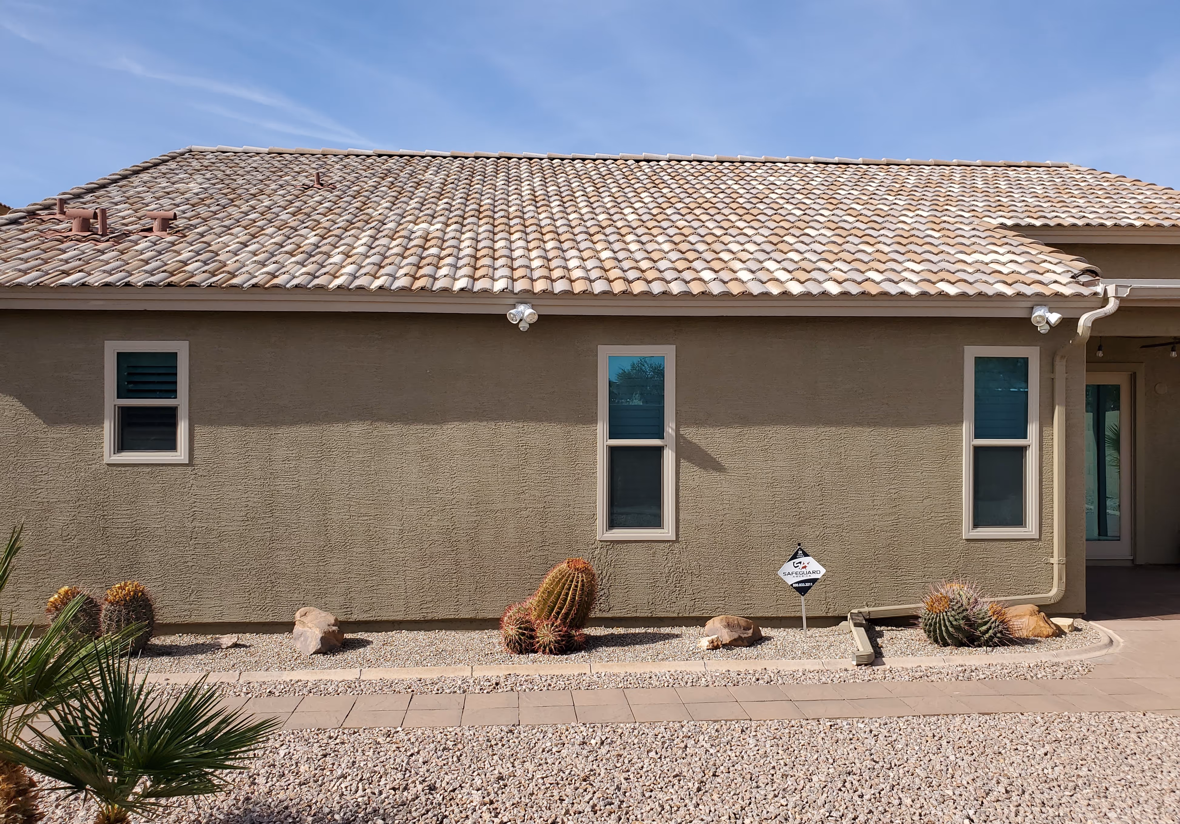 Tan frame vinyl replacement windows with Low-E glass