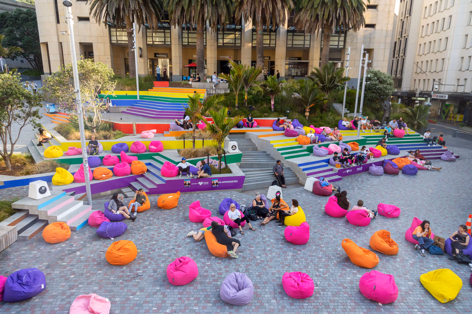 Auckland Council Pride rainbow stairs activation at Freyberg Square with colourful bean bags, designed, fabricated and installed by Blink, Auckland
