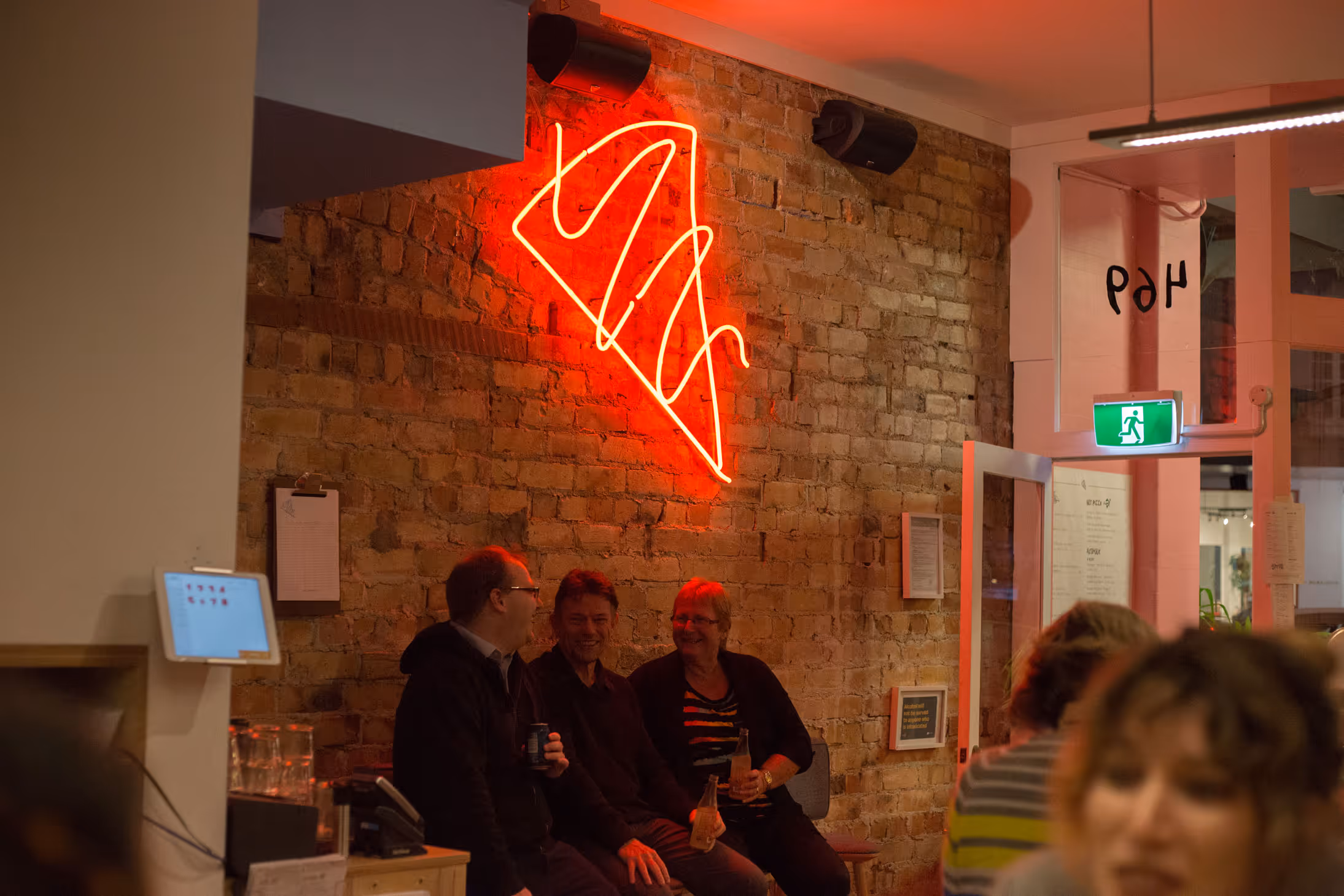 Umu Pizza interior neon sign on brick wall, designed, fabricated and installed by Blink, Auckland