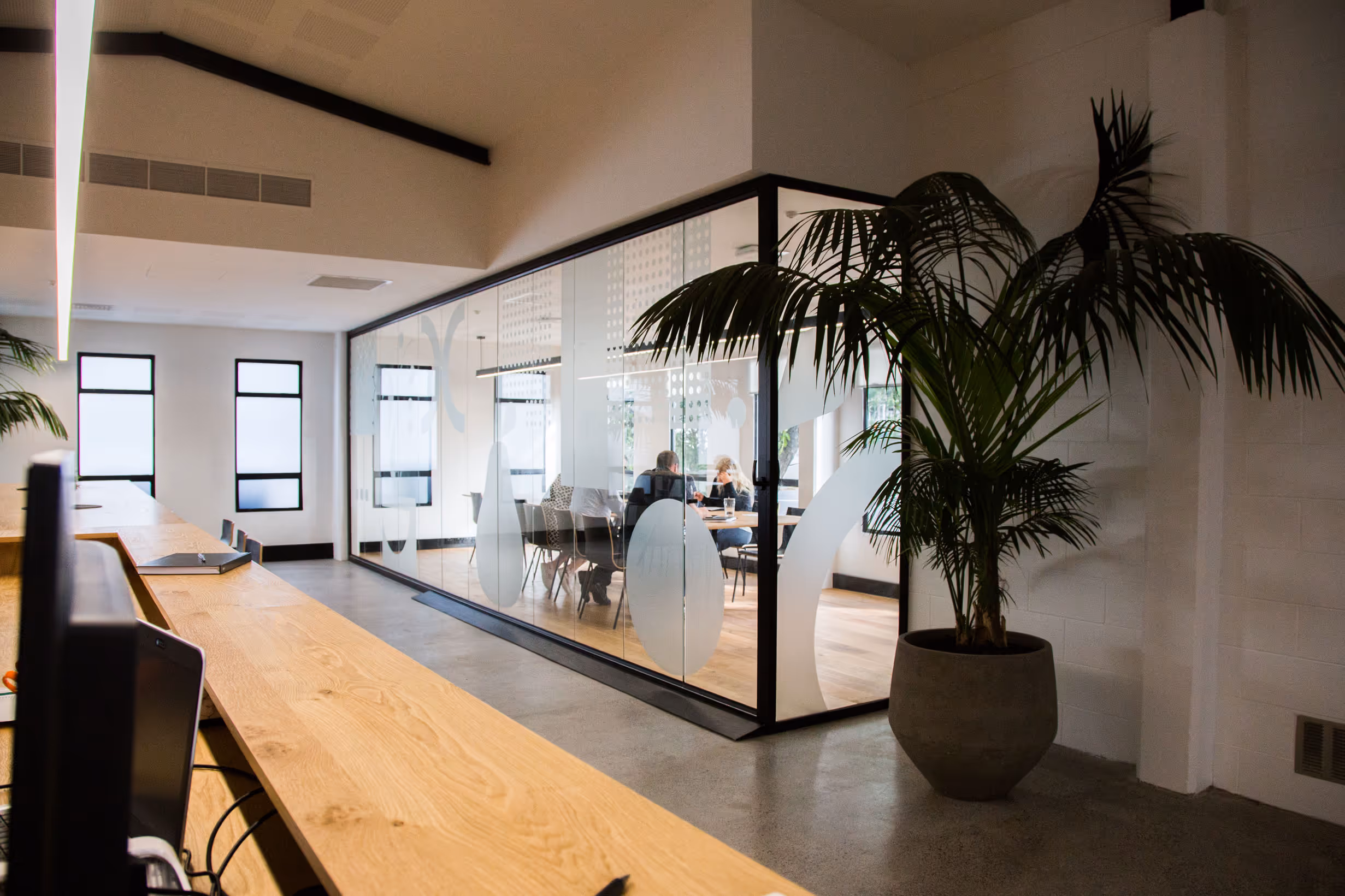 ustom frosted window graphics on glass enclosed meeting room for Collective workspace by Blink