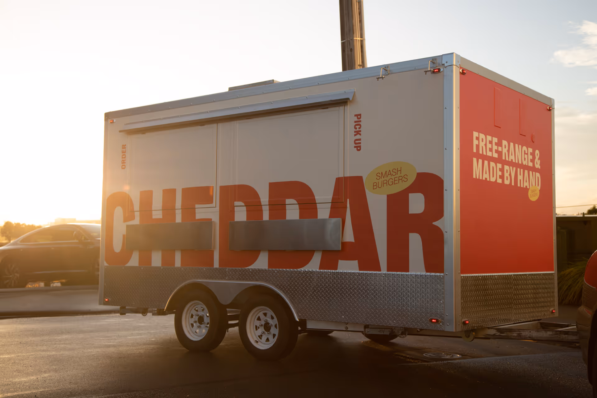Cheddar branded food trailer with large format vinyl wrap, designed, fabricated and installed by Blink, Auckland