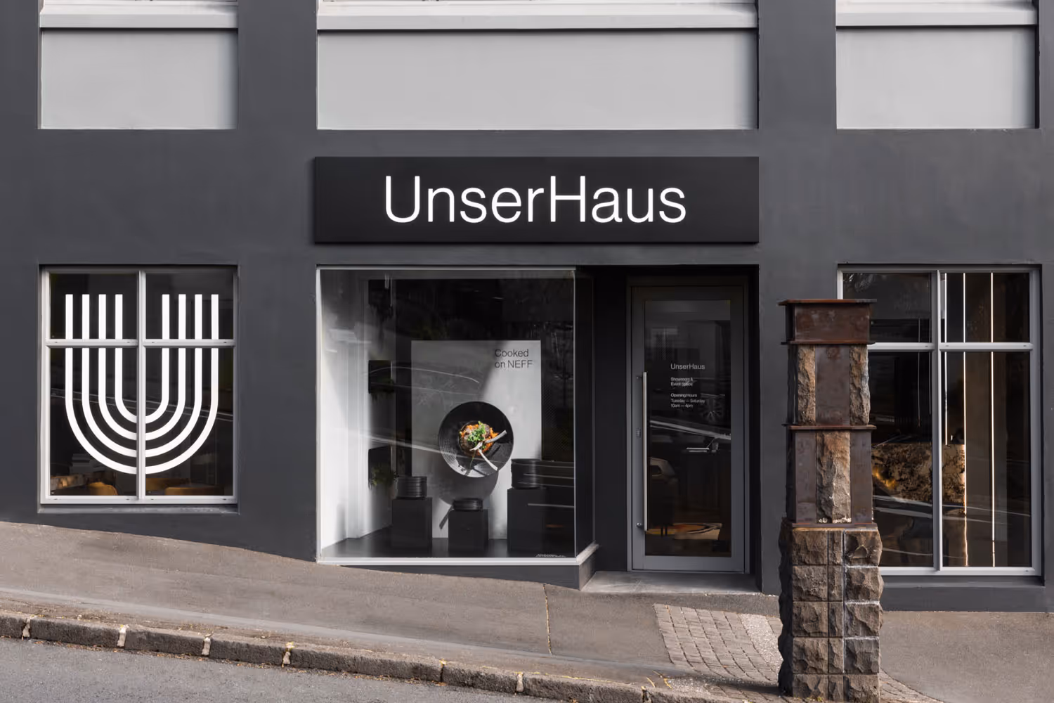UnserHaus Parnell exterior lightbox signage and window vinyl, designed by Studio South, fabricated and installed by Blink, Auckland