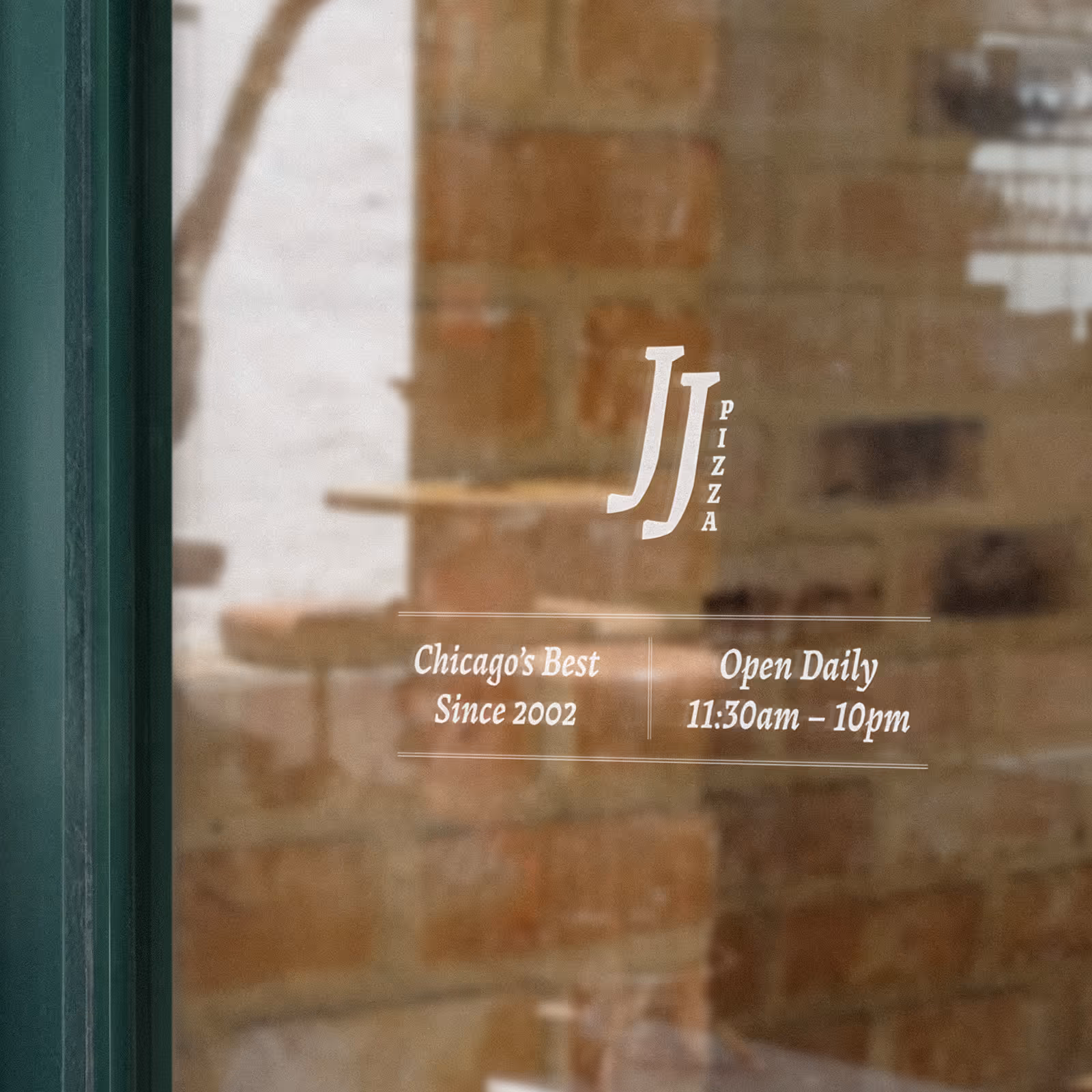 Window decal for JJ Pizza with text 'Chicago's Best Since 2002' and 'Open Daily 11:30am – 10pm' on brick background.